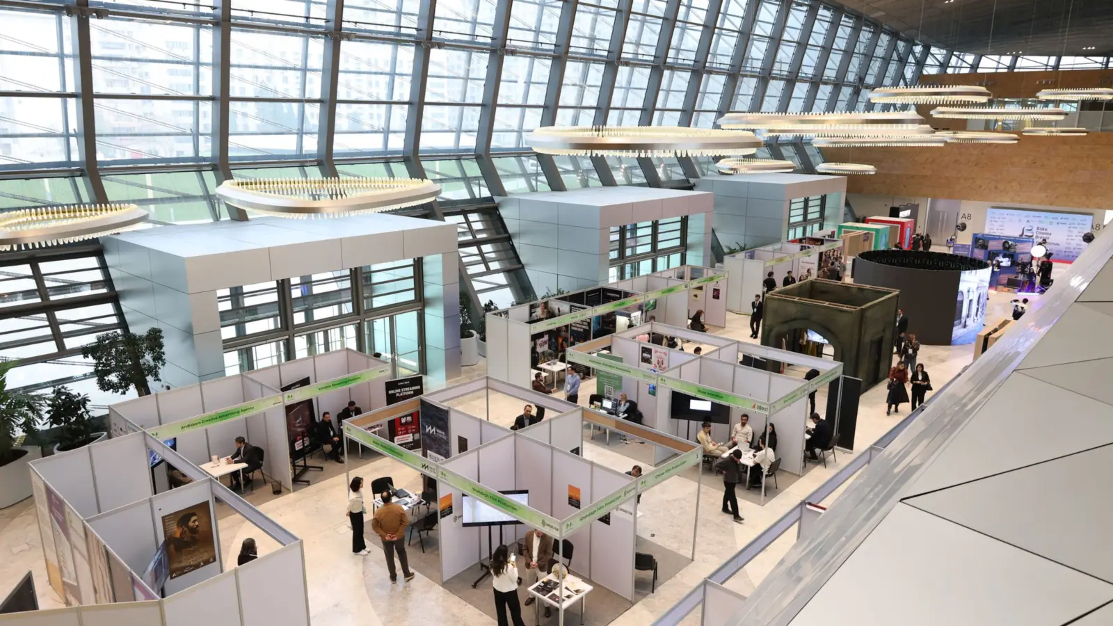 Exhibition hall with stands and visitors – trade fair parking at Hanover Airport