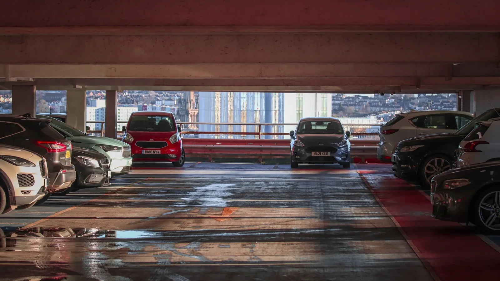 Parking deck in a multi-storey car park with cars – parking options at Berlin (BER) Airport