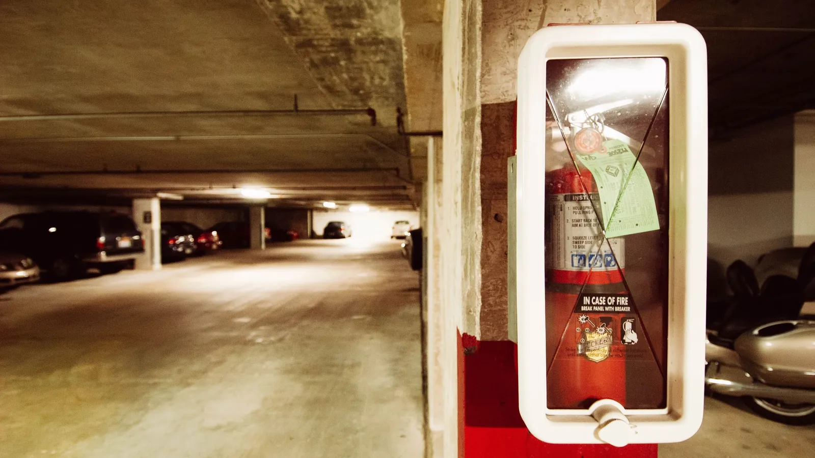 Underground car park with a fire extinguisher on a pillar – parking options at Karlsruhe/Baden-Baden Airport