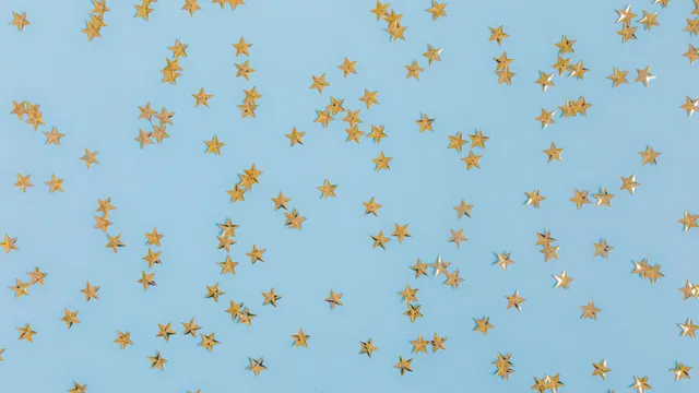 Kleine goldene Sterne auf blauem Hintergrund – Parkservice am Flughafen Hannover auswählen