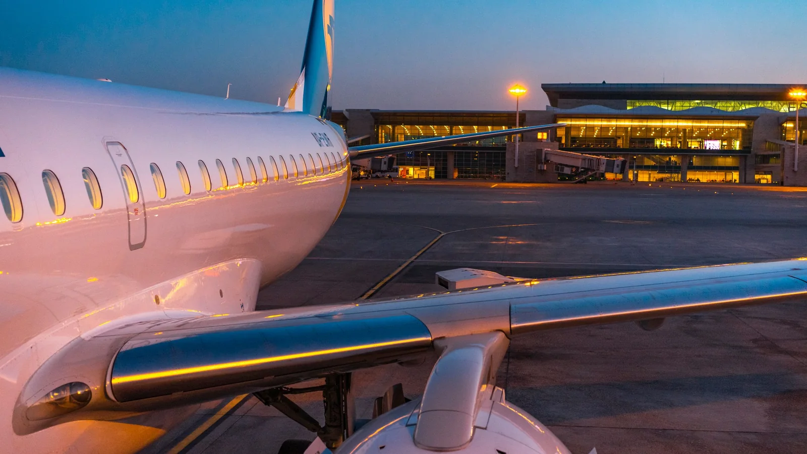 Aircraft at the terminal at dusk – late arrival at Dortmund Airport